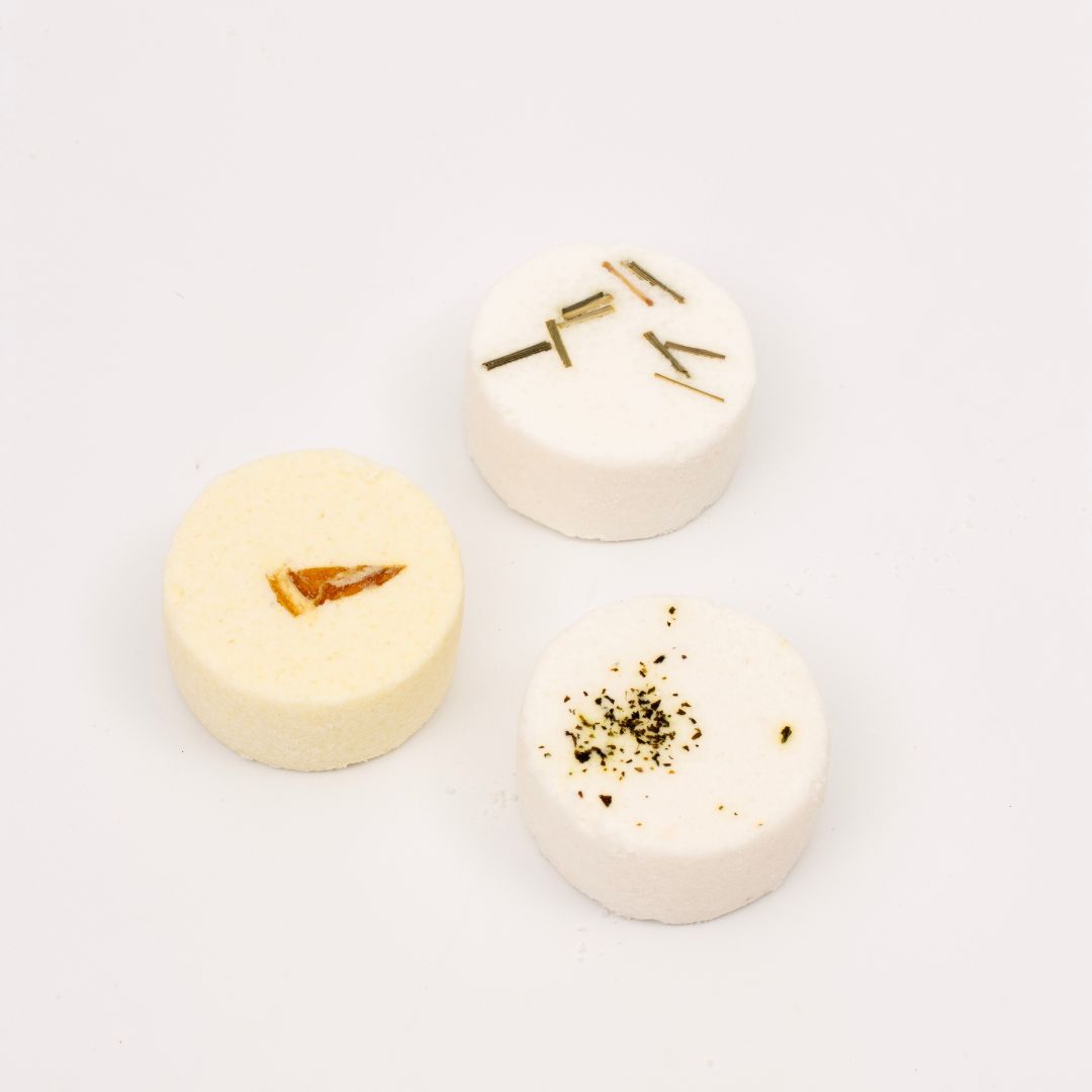 Handmade aromatherapy shower steamers for men in a gift box, featuring three essential oil blends: Clarity, Vitality, and Purity. Transform your shower into a spa experience with invigorating scents like lemongrass, eucalyptus, and citrus. Perfect for the modern man seeking a revitalising shower routine.