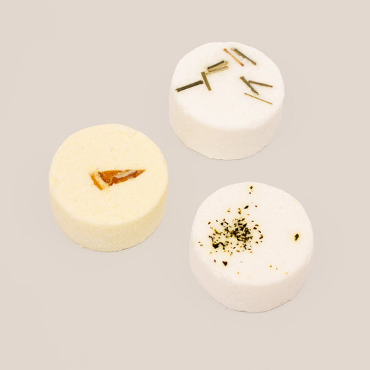 Handmade aromatherapy shower steamers for men in a gift box, featuring three essential oil blends: Clarity, Vitality, and Purity. Transform your shower into a spa experience with invigorating scents like lemongrass, eucalyptus, and citrus. Perfect for the modern man seeking a revitalising shower routine.