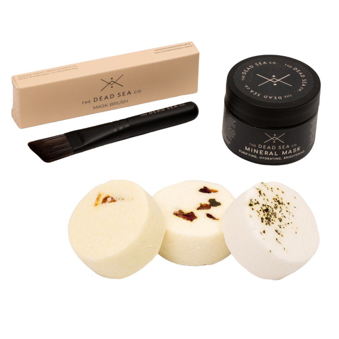 Glow & Relax Spa Bundle in an elegant gift box, featuring Dead Sea Mineral Mud Mask, brush, and three customisable aromatherapy shower steamers.